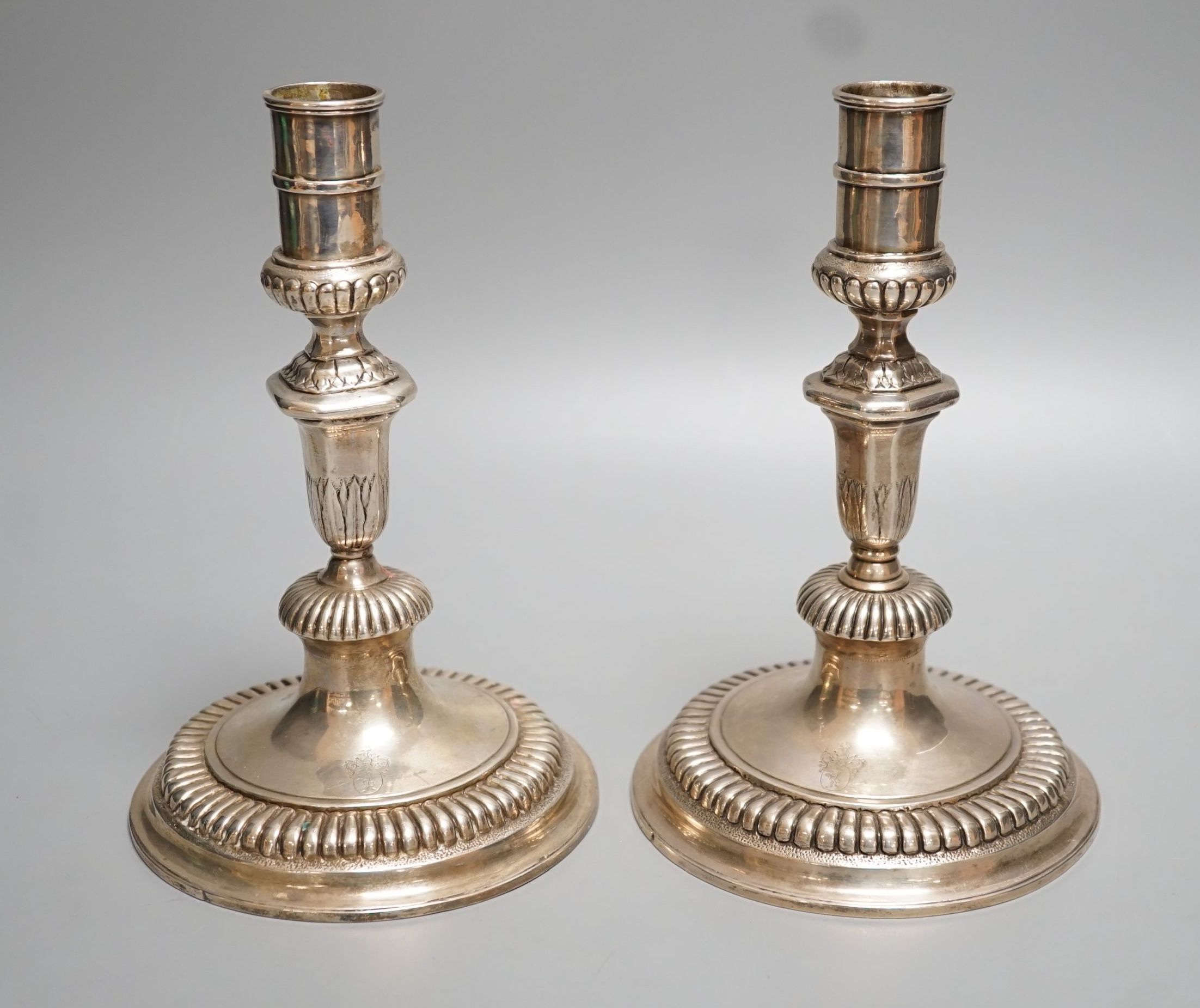 A pair of late 18th/early 19th century German? white metal candlesticks, 19.7cm, 18oz.